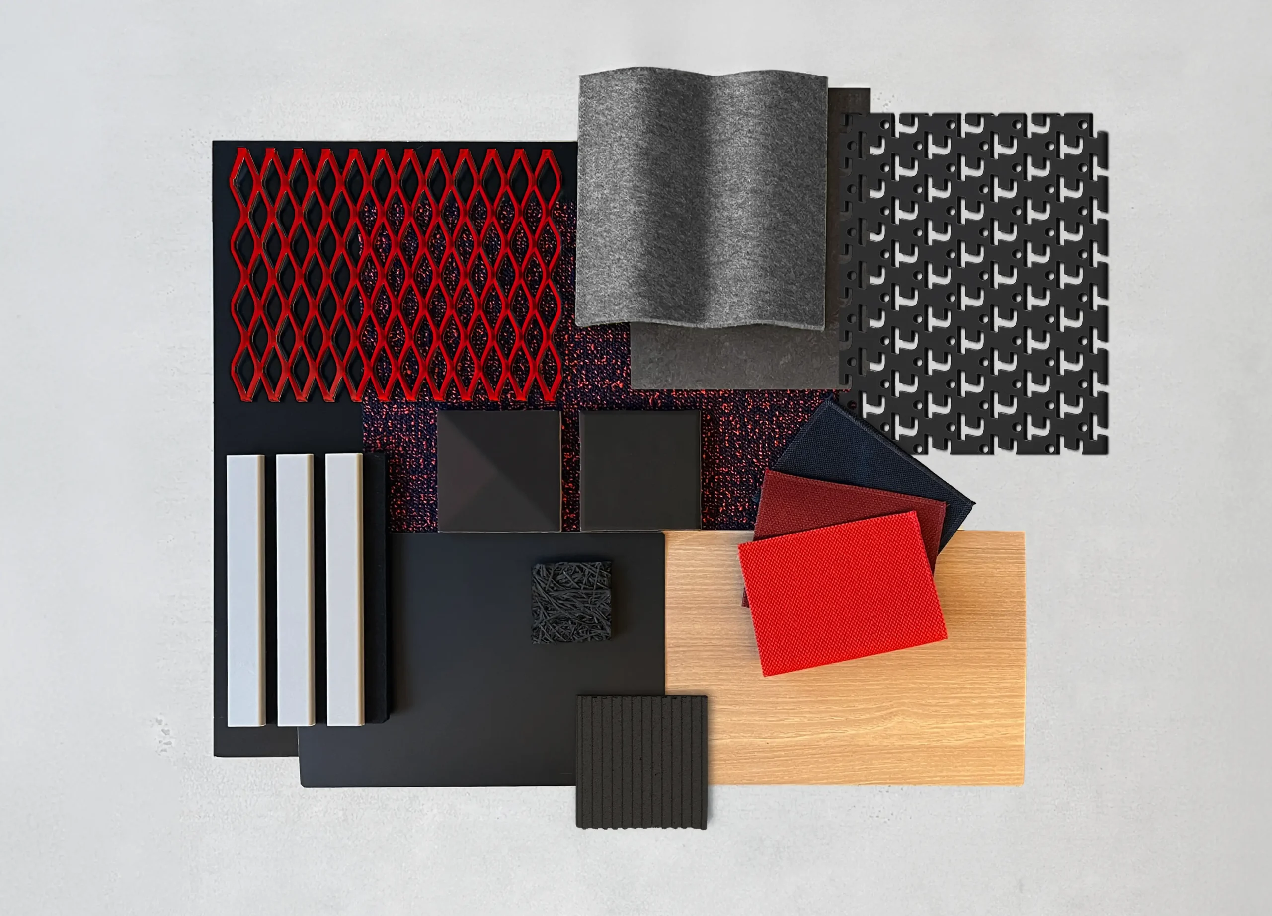 Materialboard in Rot und Schwarz mit Stoffen, Filz und Gitter