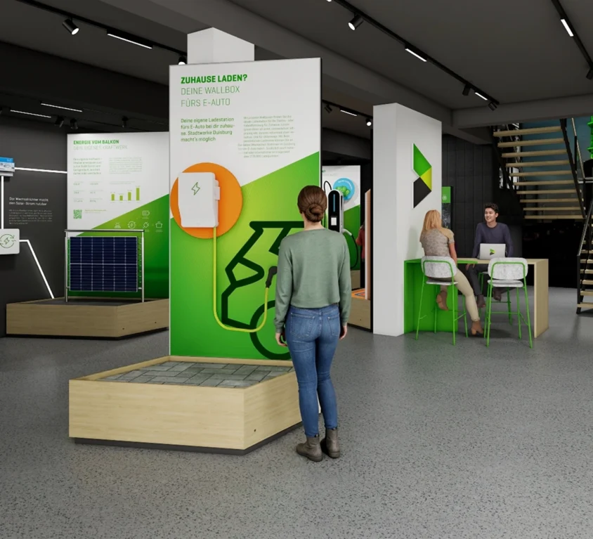 Vorschaubild für das Projekt Infocenter Energie: links sind modulare Ausstellungspodeste aufgebaut, rund um das Thema erneuerbaren Energielösungen, rechts ein Beratungstresen