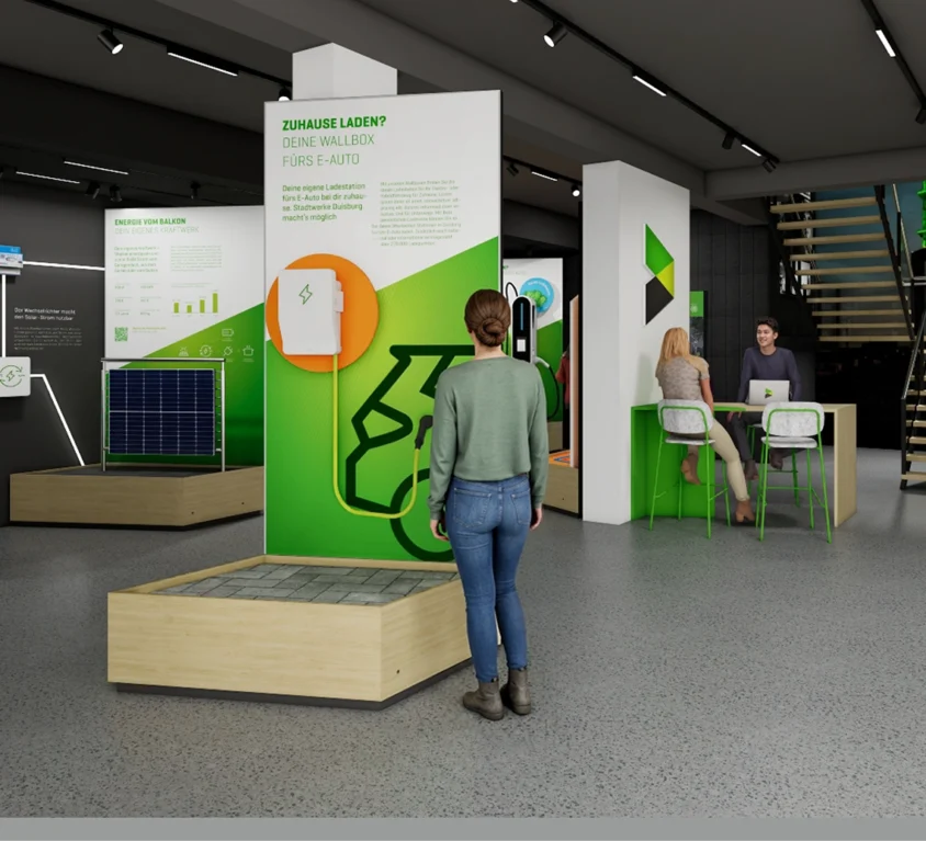 Vorschaubild für das Projekt Infocenter Energie: links sind modulare Ausstellungspodeste aufgebaut, rund um das Thema erneuerbaren Energielösungen, rechts ein Beratungstresen