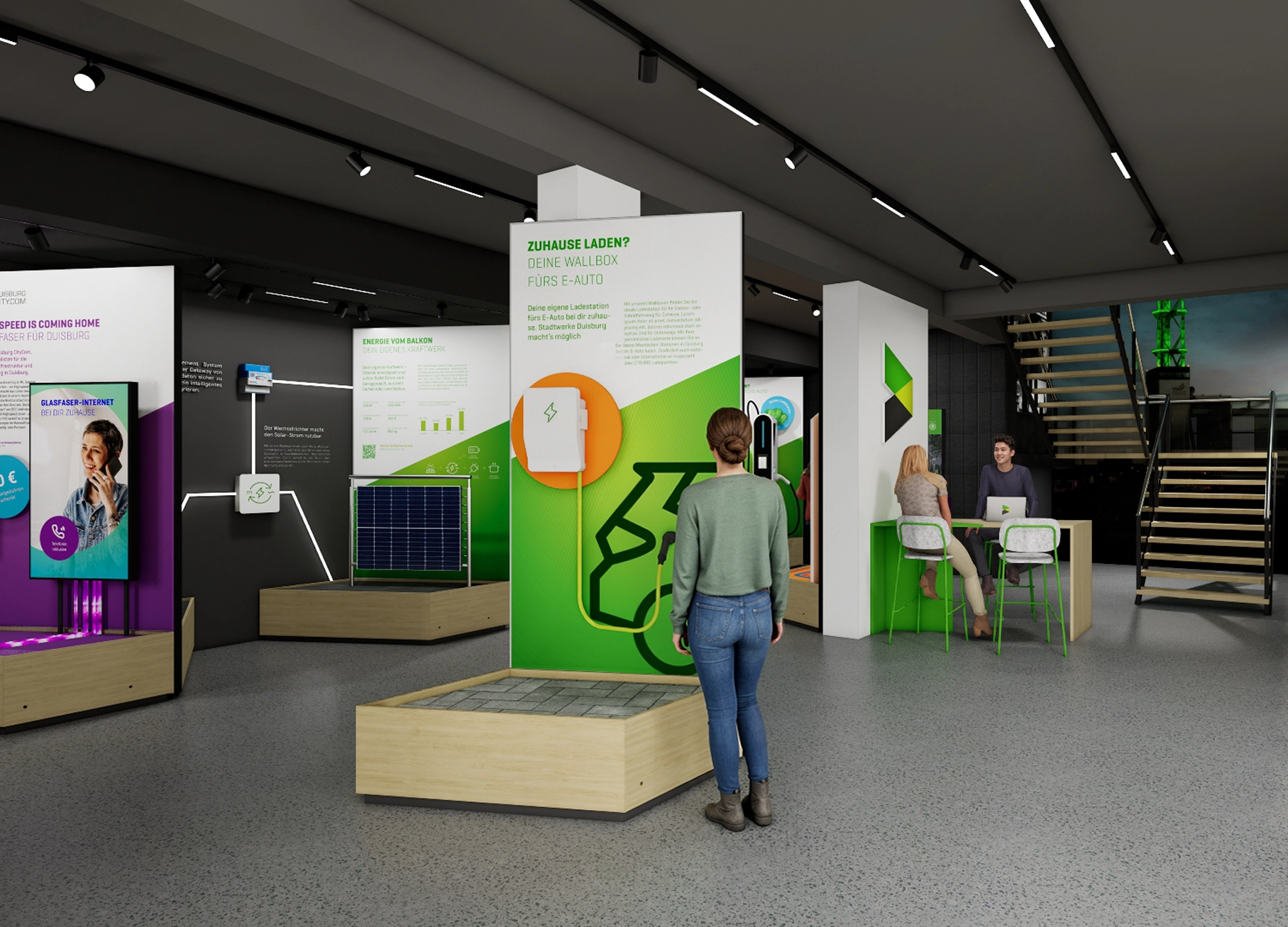 links sind modulare Ausstellungspodeste aufgebaut, rund um das Thema erneuerbaren Energielösungen, rechts ein Beratungstresen